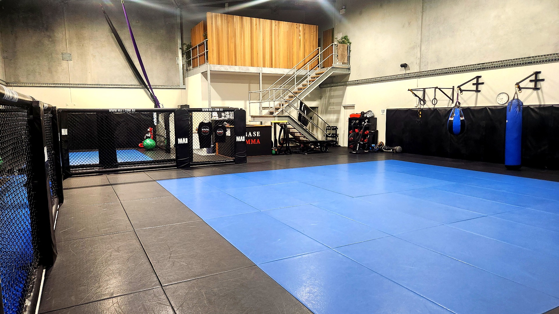 Overhead view of the BASE MMA mat space and cage